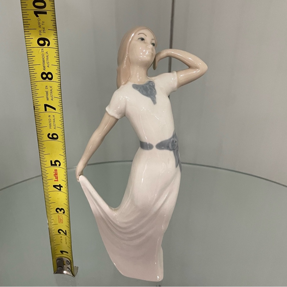 Rex Figurines with marked in blue bottom